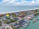 Coastal area near the beach, docks, and water activities, with the turquoise home in close proximity to beach at 106 23Rd Ave, St Pete Beach, FL 33706