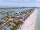 Island community with proximity to white sandy beaches with turquoise home as a serene coastal retreat at 106 23Rd Ave, St Pete Beach, FL 33706