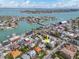 Aerial shot showcasing home's location within a coastal community, with water access and proximity to amenities at 106 23Rd Ave, St Pete Beach, FL 33706