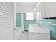 Colorful bathroom with marble counters and tile walls at 106 23Rd Ave, St Pete Beach, FL 33706