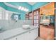 Bathroom featuring a sleek countertop, modern lighting, and decorative mirror at 106 23Rd Ave, St Pete Beach, FL 33706