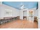 Cozy bedroom with wood floors, bright window, and adjacent entry at 106 23Rd Ave, St Pete Beach, FL 33706