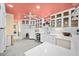 Well-lit kitchen with white cabinets, quartz countertops, and modern appliances at 106 23Rd Ave, St Pete Beach, FL 33706