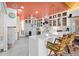 Bright, open kitchen with quartz counters, white cabinets, bar seating, and an adjacent living space at 106 23Rd Ave, St Pete Beach, FL 33706