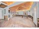 Sunroom showcasing open layout to kitchen with wood ceilings ready for renovation at 106 23Rd Ave, St Pete Beach, FL 33706