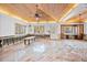 Sunroom features a wood ceiling, ample natural light, and an open layout ready for renovation at 106 23Rd Ave, St Pete Beach, FL 33706