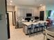 Kitchen with modern island, bar seating, and stainless appliances, offering a sleek and functional design at 11833 Clare Hill Ave, Riverview, FL 33579
