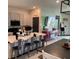 Bright kitchen features a large island with seating, stainless steel appliances, and gray cabinets at 11833 Clare Hill Ave, Riverview, FL 33579