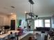 Spacious open floor plan with eat-in kitchen, stylish lighting, and comfortable living area perfect for entertaining at 11833 Clare Hill Ave, Riverview, FL 33579