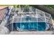 A screened pool is surrounded by a large patio, offering a perfect spot for outdoor entertaining at 1201 Kapok Kove Cir, Clearwater, FL 33759