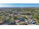 A scenic aerial view of a neighborhood near the water, highlighting lush greenery and community layout at 1201 Kapok Kove Cir, Clearwater, FL 33759