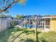 The fenced backyard features a screened pool and plenty of green space at 1201 Kapok Kove Cir, Clearwater, FL 33759