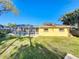The fenced backyard features a screened pool and plenty of green space at 1201 Kapok Kove Cir, Clearwater, FL 33759