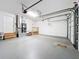 Two-car garage with painted floors, garage door openers and access to the home at 1201 Kapok Kove Cir, Clearwater, FL 33759