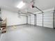 Spacious two-car garage with painted floors and garage door openers at 1201 Kapok Kove Cir, Clearwater, FL 33759