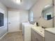 Laundry area featuring a washer and dryer next to a utility sink at 1201 Kapok Kove Cir, Clearwater, FL 33759