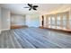 Bright living room featuring luxury vinyl plank flooring, and neutral paint at 1201 Kapok Kove Cir, Clearwater, FL 33759