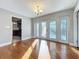 Bright living area featuring hardwood floors and French doors to an outdoor space at 1201 Kapok Kove Cir, Clearwater, FL 33759