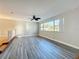 Living room with luxury vinyl plank flooring, neutral paint, and a ceiling fan at 1201 Kapok Kove Cir, Clearwater, FL 33759