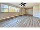 Open-concept living area with hardwood floors and neutral-colored walls at 1201 Kapok Kove Cir, Clearwater, FL 33759