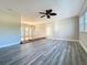 Living room featuring luxury vinyl plank flooring and neutral paint at 1201 Kapok Kove Cir, Clearwater, FL 33759