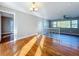 Open concept living area featuring hardwood floors and natural light, perfect for modern living at 1201 Kapok Kove Cir, Clearwater, FL 33759