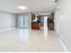 Open-concept living room showcases bright tile floors with a combined dining and kitchen area at 1201 Kapok Kove Cir, Clearwater, FL 33759