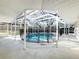 A screened in pool with a safety fence provides hours of Gathering fun at 1201 Kapok Kove Cir, Clearwater, FL 33759