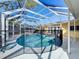 A screened in pool provides the perfect private place to relax at 1201 Kapok Kove Cir, Clearwater, FL 33759