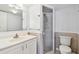 Clean bathroom featuring a shower, toilet, and vanity at 12300 Vonn Rd # 2204, Largo, FL 33774
