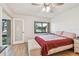 Bedroom with a ceiling fan, hardwood floors, and natural light at 12300 Vonn Rd # 2204, Largo, FL 33774