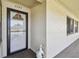 Condo entrance featuring a decorative wreath on the door and a ceramic duck statue at 12300 Vonn Rd # 2204, Largo, FL 33774
