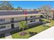 Relaxing community features a two-story condo with balconies and beautifully manicured grounds at 12300 Vonn Rd # 2204, Largo, FL 33774