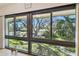 Large windows offering beautiful views of the property's greenery and landscaping at 12300 Vonn Rd # 2204, Largo, FL 33774