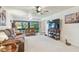 Bright living room with comfortable seating, a large window view, and stylish decor at 12300 Vonn Rd # 2204, Largo, FL 33774