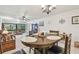Spacious living room with a dining area, large windows, and comfortable seating at 12300 Vonn Rd # 2204, Largo, FL 33774