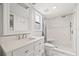 Bathroom featuring a marble walk-in shower, with modern vanity and sink at 12762 98Th St, Largo, FL 33773