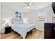 Comfortable bedroom with a light blue comforter and light wood floors at 12762 98Th St, Largo, FL 33773