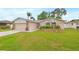 Well-maintained single-story home boasting lush lawn, stone accents, and inviting curb appeal at 12762 98Th St, Largo, FL 33773