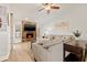 Inviting living room featuring a stone fireplace, wood floors, and ample seating at 12762 98Th St, Largo, FL 33773