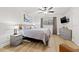 Calm main bedroom features soft colors, ceiling fan, and light wood flooring at 12762 98Th St, Largo, FL 33773