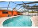 Enjoy outdoor living with a screened pool, dining set, and ample space for entertaining and relaxation at 12762 98Th St, Largo, FL 33773