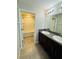 Bathroom featuring dual sinks, granite countertop, vanity and a bath tub shower combo at 14050 Arbor Pines Dr, Riverview, FL 33579