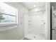 Bathroom with a new shower, bright window, and light interior at 14050 Arbor Pines Dr, Riverview, FL 33579