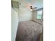 Bedroom featuring carpet floors, ceiling fan, and bright natural lighting at 14050 Arbor Pines Dr, Riverview, FL 33579