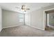 Bedroom featuring neutral paint, plush carpet, closet and natural light at 14050 Arbor Pines Dr, Riverview, FL 33579
