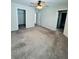 Bedroom features carpet floors, walk in closet, and attached bathroom at 14050 Arbor Pines Dr, Riverview, FL 33579