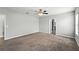Spacious bedroom with neutral walls, carpeted floor, and a ceiling fan at 14050 Arbor Pines Dr, Riverview, FL 33579