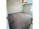 Spacious bedroom features a ceiling fan and carpeted floors at 14050 Arbor Pines Dr, Riverview, FL 33579