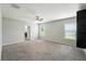 Large, carpeted main bedroom with a ceiling fan and ample natural light at 14050 Arbor Pines Dr, Riverview, FL 33579